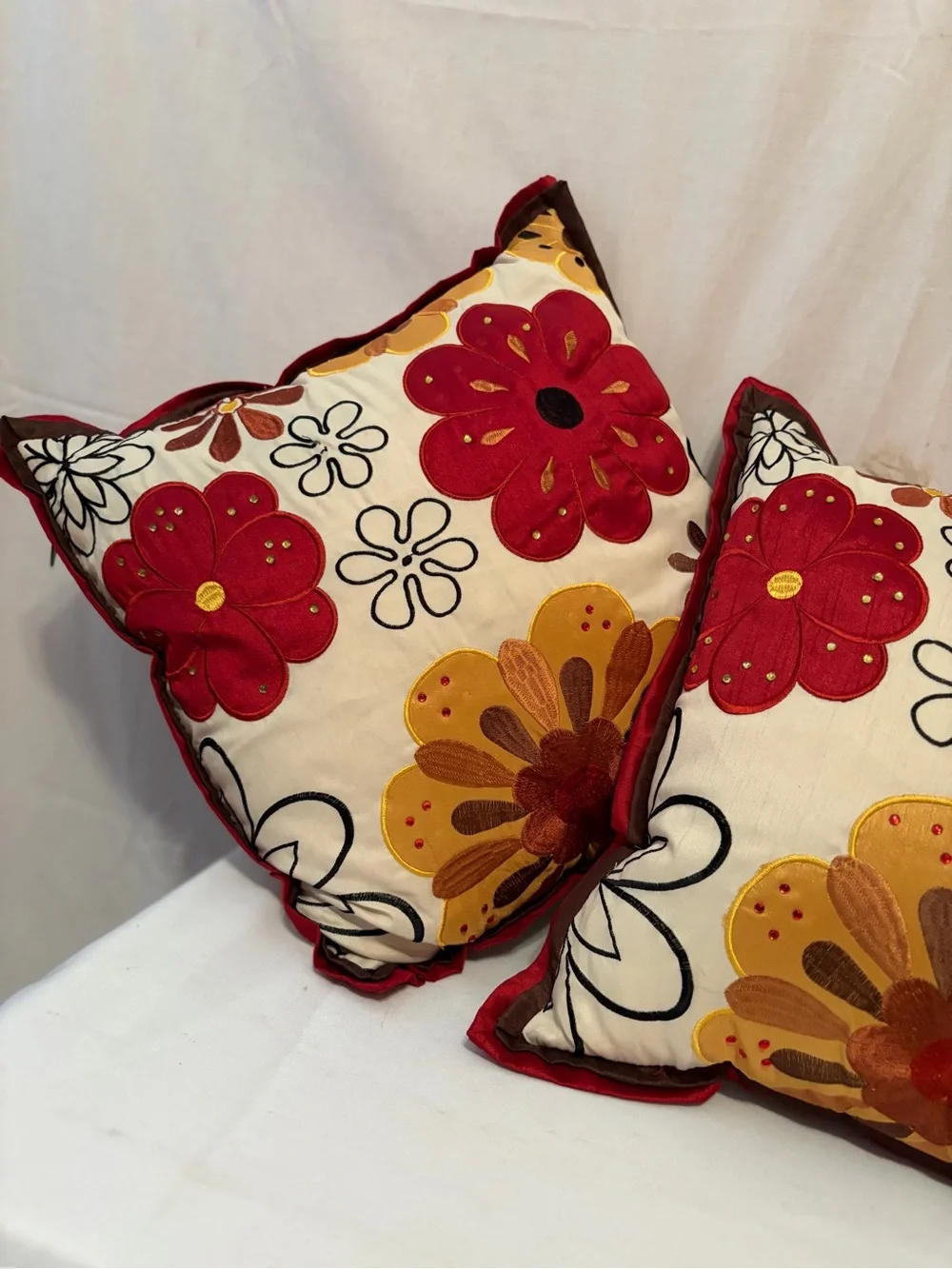 Pier 1 Imports pillows vibrant floral embroidery in red and gold